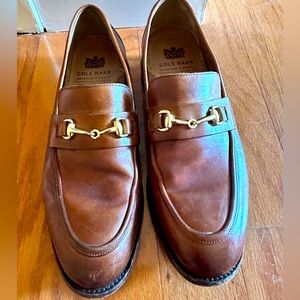 Cole Haan lightly used loafers wig Gold buckle.